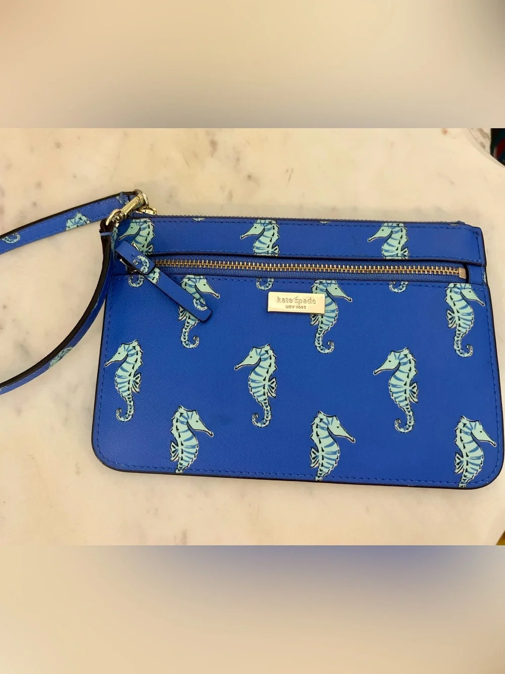 kate spade cobalt blue seahorse wristlet clutch